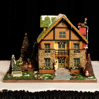 <p><b>Location:</b> The Grove Park Inn & Spa's 2009 Gingerbread Competition (Asheville, NC)</p>
<p>Carolina Montoya and husband Fernado Puga spent 302 hours over the course of two months to create their gingerbread house. The traditionally designed structure featured President Barack Obama, who appeared to be climbing out the window and up onto the chimney with a bag full of toys. Montoya and Puga's all-edible entry was constructed of gingerbread, fondant, gum paste, coconut, Rice Krispies cereal, and breath strips for window panes.</p>
