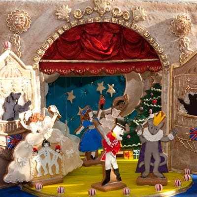 <p><b>Location:</b> The New York Botanical Garden's 2010 Gingerbread Adventures (Bronx, NY)</p>
<p>It took four full days, two bakers (Kate Sullivan of Cake Power and Patti Paige of Baked Ideas) and two interns to complete this theatrical project from beginning to end. Modeled on the stage of the London Coliseum opera house, the structure — measuring 18 inches tall — and characters were all made of gingerbread, while the red curtain above was covered in fondant. Everything except the red-and-white striped mint balls was either baked from scratch or rolled, cut, piped or painted in food color by hand.</p>