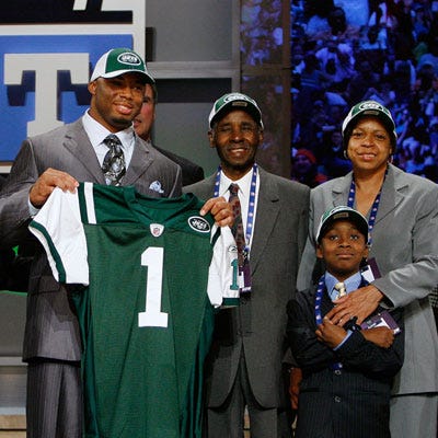 <p>Former defensive end Vernon Gholston made it to the big time in 2008, when he was drafted by the New York Jets. A pizza fanatic, joining the Jets brought Gholston easy access to an authentic New York pie, which always makes an appearance on his game day menu. But unlike most of us, Gholston swaps out the traditional Super Bowl staple, Buffalo wings, for succulent ribs. "My mom would always get us <a href="http://gogonow.org/recipefinder/ribs-supreme-2396%22target=%22_blank%22%3E%3Cb%3Eribs%3C/b%3E%3C/a%3E,%22 says Gholston. What else does Gholston miss about his mom's home cooking? "I like breakfast and [my mom] makes pretty good pancakes."</p>