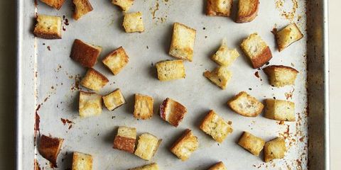 Stop! Don't toss out that loaf of stale bread that's sitting on your counter. Instead, give it a new life by transforming it into shatteringly crisp croutons — it only takes a few minutes, and the results are far tastier than store-bought varieties. Whether you have half a loaf of bread leftover or only a few slices, the technique is simple and scalable.
