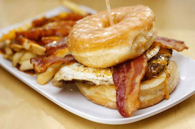 <p>The Luther isn't by any means the only over-the-top burger on the <a href="http://craverealburgers.com/burgers/" target="_blank">Crave menu</a>, but it begs recognition for it's crowning achievement of bringing together sweet and savory in one burger — the typical buns are replaced with glazed donuts. This chicken and waffles meets burger hybrid might leave you asking, "Why haven't be always been doing this?"</p>
<p><em><strong>Crave Real Burgers:</strong> multiple locations; <a href="http://craverealburgers.com/" target="_blank">craverealburgers.com</a></em></p>