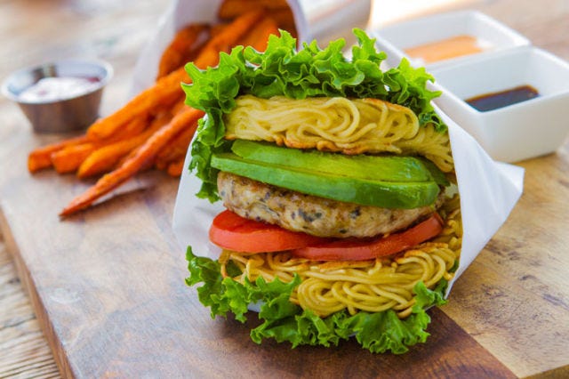 <p>If a burger piled high with toppings wasn't enough for you, there's always a piled-high burger sandwiched between pressed ramen for the ultimate salute to carbs. This version at <a href="http://www.rakirakiramen.com" target="_blank">Rakiraki</a> boasts lettuce, tomato, spicy mayo, five-spice soy sauce, and a chicken patty. Still have room after? All of their ramen burgers come with sugar-dusted sweet potato fries!</p>
<p><em><strong>Rakiraki:</strong> 4646 Convoy St, San Diego, CA 92111; (858) 573-2400; <a href="http://www.rakirakiramen.com" target="_blank">rakirakiramen.com</a></em></p>