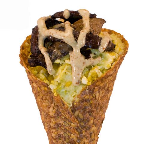 <p>Known as the "MacGuyver of vegan food," <a href="http://www.rawdaddyfoods.com/" target="_blank">RawDaddy Foods</a> founder James Hall wasn't doing anything the easy way when he set out to transform vegan dishes into portable meals in savory flaxseed and buckwheat cones. Fresh from the cob polenta, usually an eat-with-a-fork vegetarian or vegan dinner staple, is topped with mushrooms and a drizzle of sweet mustard sauce to become a nourishing meal on the go. Is it any wonder this is their best seller?</p>