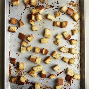Stop! Don't toss out that loaf of stale bread that's sitting on your counter. Instead, give it a new life by transforming it into shatteringly crisp croutons — it only takes a few minutes, and the results are far tastier than store-bought varieties. Whether you have half a loaf of bread leftover or only a few slices, the technique is simple and scalable.