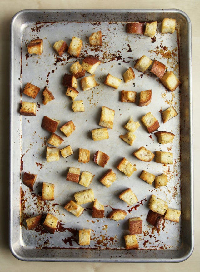Stop! Don't toss out that loaf of stale bread that's sitting on your counter. Instead, give it a new life by transforming it into shatteringly crisp croutons — it only takes a few minutes, and the results are far tastier than store-bought varieties. Whether you have half a loaf of bread leftover or only a few slices, the technique is simple and scalable.