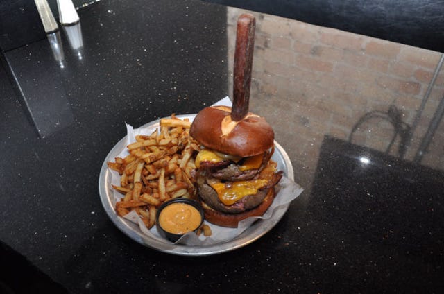 <p>If you're on the hunt for a truly outrageous burger, you'll have plenty of options at <a href="http://www.lockdownbar.com/" target="_blank">The Lockdown Bar and Grill</a>. The Death Sentence, a burger weighed down with 20 ounces of beef, yellow cheddar, and caramelized onions, may be a carnivore's ideal way to go. Don't decide too quickly, though; the Conjugal Visit — Thanksgiving in a bun — and Cruelty to Animals — a triple-down on pork — will also satisfy your biggest meat craving.</p>
<p><em><strong>The Lockdown Bar and Grill:</strong> 1024 N Western Ave, Chicago, IL 60622; (773) 451-5625; <a href="http://www.lockdownbar.com/" target="_blank">lockdownbar.com</a></em></p>