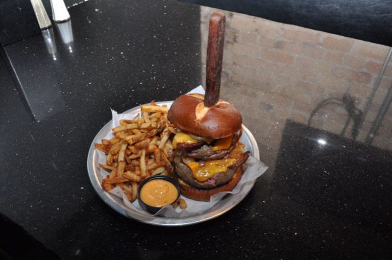 <p>If you're on the hunt for a truly outrageous burger, you'll have plenty of options at <a href="http://www.lockdownbar.com/" target="_blank">The Lockdown Bar and Grill</a>. The Death Sentence, a burger weighed down with 20 ounces of beef, yellow cheddar, and caramelized onions, may be a carnivore's ideal way to go. Don't decide too quickly, though; the Conjugal Visit — Thanksgiving in a bun — and Cruelty to Animals — a triple-down on pork — will also satisfy your biggest meat craving.</p>
<p><em><strong>The Lockdown Bar and Grill:</strong> 1024 N Western Ave, Chicago, IL 60622; (773) 451-5625; <a href="http://www.lockdownbar.com/" target="_blank">lockdownbar.com</a></em></p>