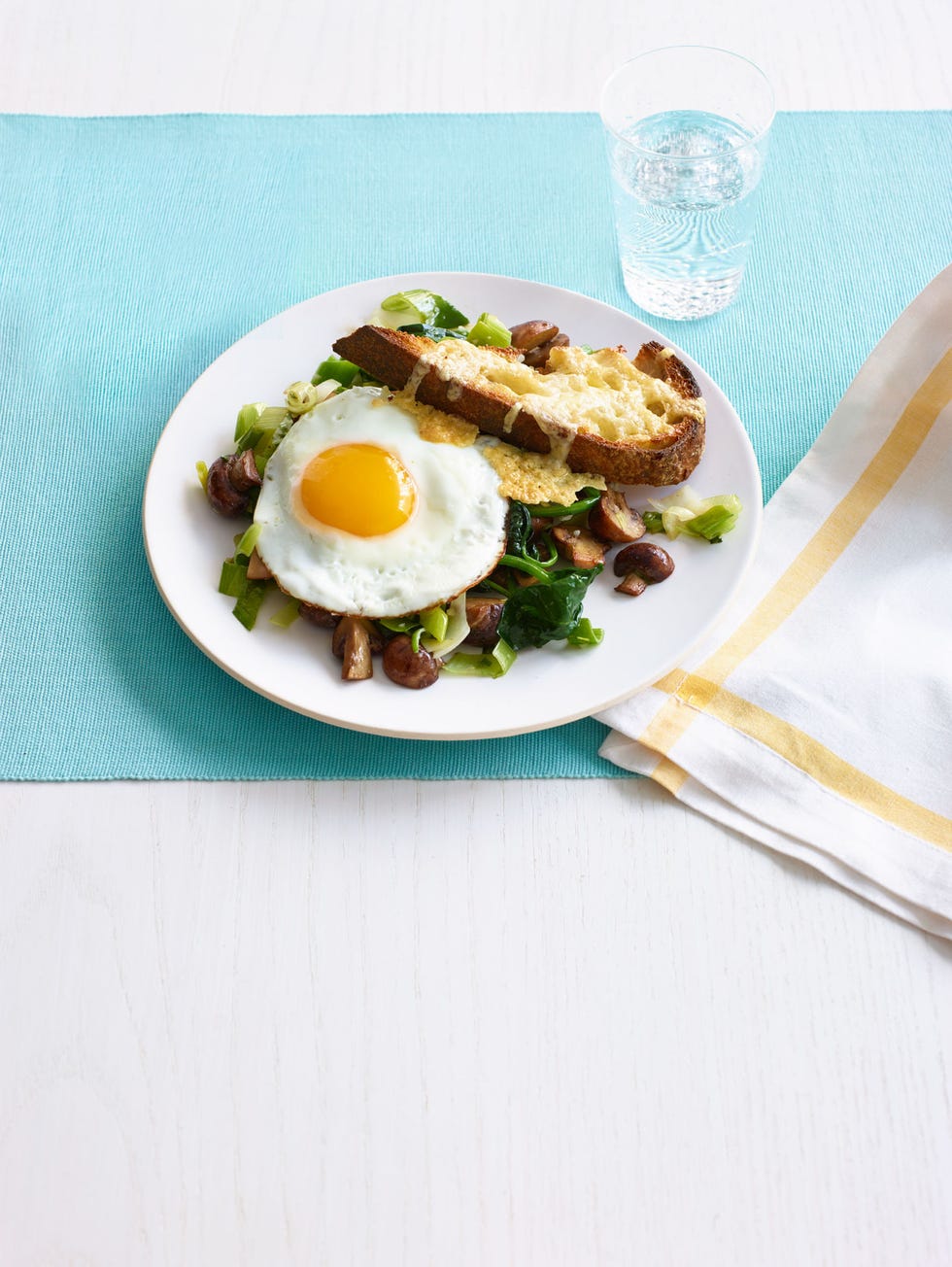 Leeks and Mushrooms on Cheesy Toasts with Fried Eggs