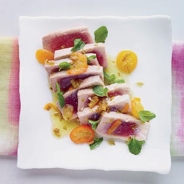 <p>This incredibly quick and easy dish from New Orleans chef Donald Link's <i>Down South</i> cookbook features tuna steaks poached until rare in a bright, buttery sauce that's infused with tangy lime and kumquats, spicy jalapeños, and fresh mint. Doubled or tripled, it would make an excellent dinner-party dish.</p><p><strong>Recipe:</strong> <a href="http://gogonow.org/recipefinder/poached-tuna-kumquats-jalapeno-recipe-fw0314%22%3E%3Cstrong%3EPoached Tuna with Kumquats and Jalapeño</strong></a></p>