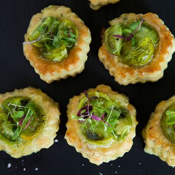 <p>These beautiful tarts are filled with creamy smoked cheddar cheese and roasted green tomatoes for an easy, delicious snack.</p><p><strong>Recipe:</strong> <a href="http://www.delish.com/recipefinder/roasted-green-tomato-smoked-cheddar-tarts-recipe-fw0614"><strong>Broiled </strong></a></p>Roasted Green Tomato and Smoked Cheddar Tarts