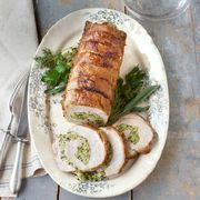 An aromatic brine of juniper, cardamom, and bay imbues this lean cut with juicy flavor; a breadcrumb filling verges on extravagance.
 Recipe: Roast Pork Loin with Herb Stuffing