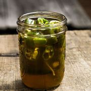<p>Sweet meets heat in these honey-bourbon-soaked peppers. Instead of fermenting the veggies for a couple weeks, Lee uses vinegar to speed up the process. "Yes, true pickles would keep longer," he admits, "but these are so good, they won't last long anyway."</p>
<p><strong>Recipe:</strong> <a href="http://www.countryliving.com/recipefinder/quick-bourbon-pickled-jalapenos-recipe-clv0513" target="_blank">Quick Bourbon-Pickled Jalapeños</a></p>