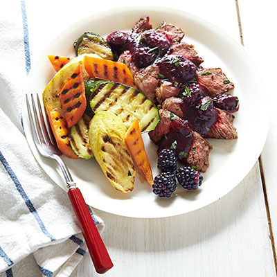rosemary rubbed strip steak with blackberry sauce