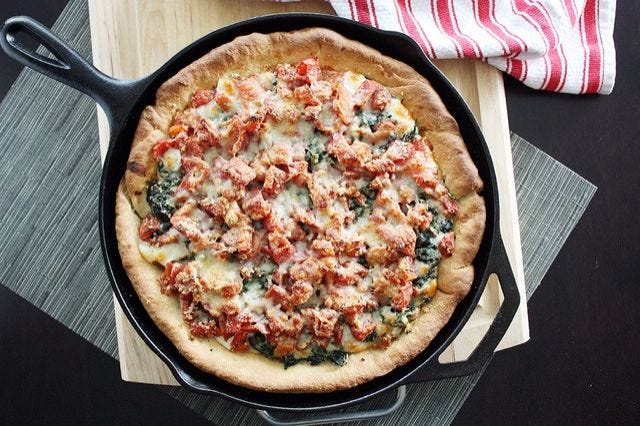deep dish spinach and tomato pizza