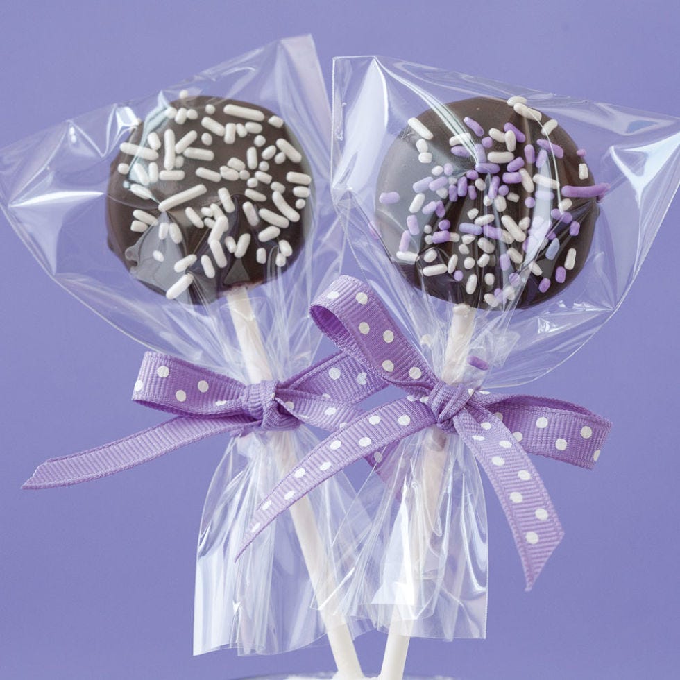 <p>Of all the stuff that's ever been served on a stick, the lollipop is the most iconic. But there's nothing ordinary about this version: disks of creamy sugar cookie dough enrobed in a dark chocolate coating and adorned with a rainbow of colored sprinkles.</p>
<p><strong>Recipe:</strong> <a href="http://gogonow.org/recipefinder/sugar-cookie-dough-lollipops-del0514%22%3E%3Cstrong%3ESugar Cookie Dough Lollipops</strong></a></p>