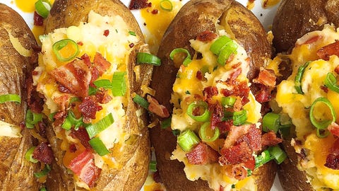 Best Loaded Baked Potatoes With Bacon And Cheddar Recipe How To Make Loaded Baked Potatoes With Bacon And Cheddar Delish Com