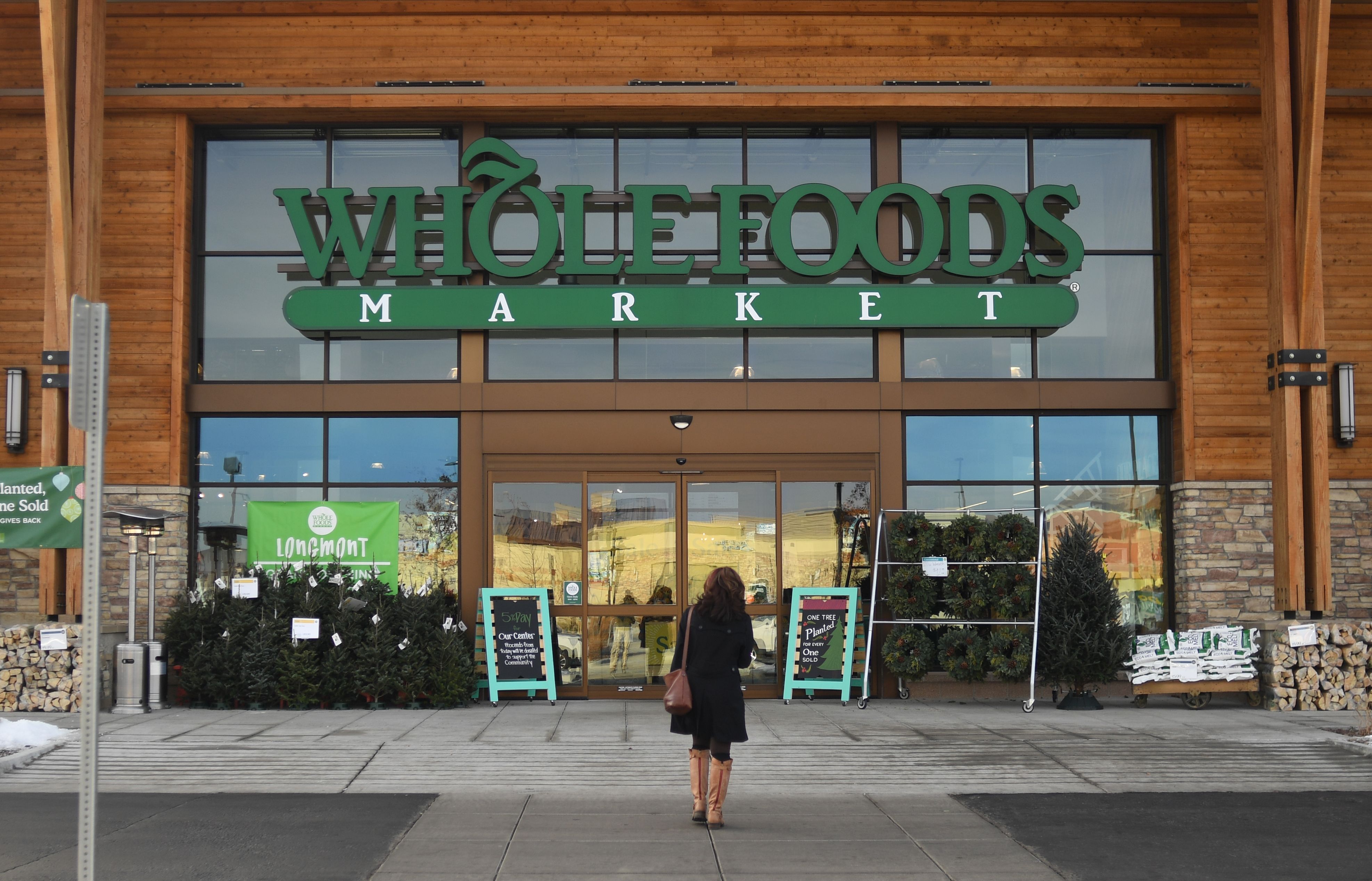 tacks on fee for Prime members who shop at Whole Foods
