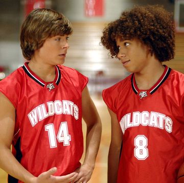 zac efron and corbin bleu in high school musical as troy and chad, in their red basketball outfits