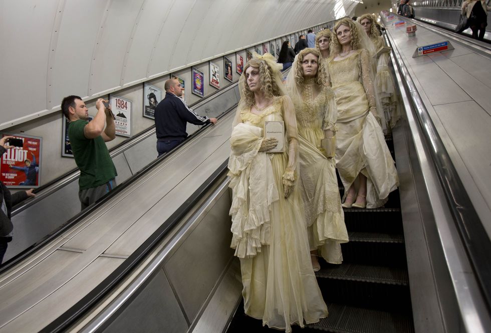 Escalator, Standing, Fashion, Bridal clothing, Gown, Bride, Wedding dress, Haute couture, Engineering, Bridal party dress, 