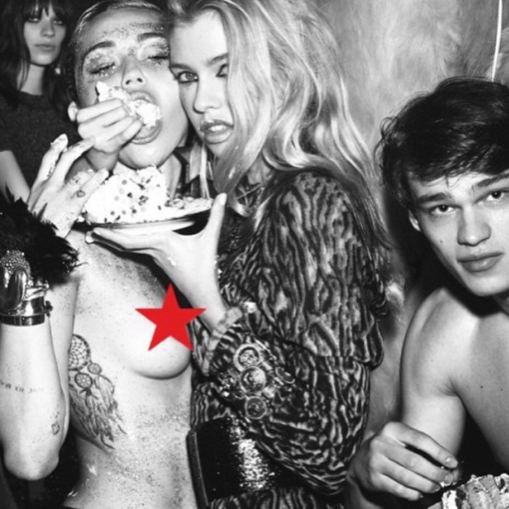 Topless Miley Cyrus fed cake by girlfriend