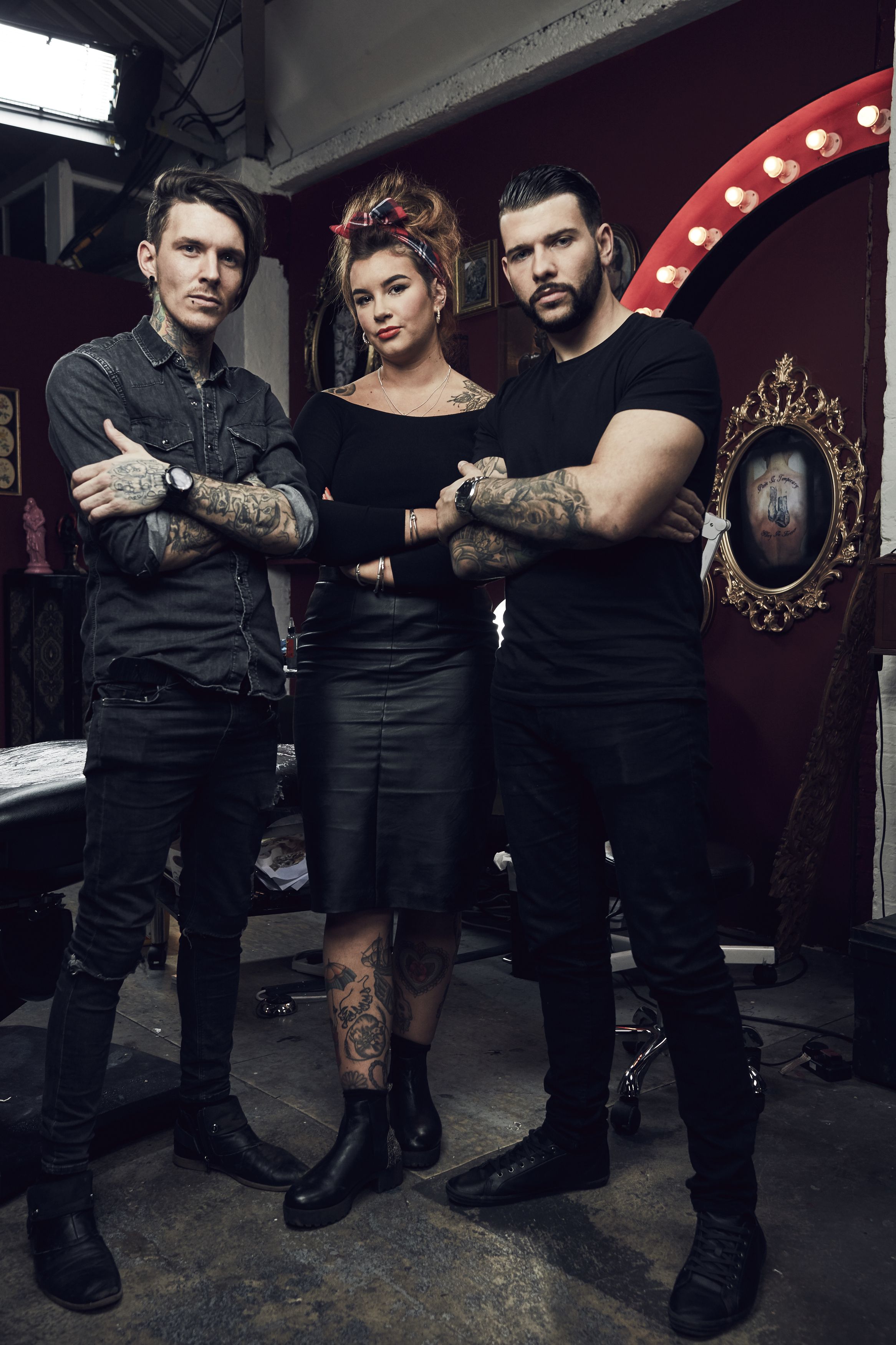 Left to right Models Xena Gusthart and Jay Johnson with Tattoo Fixers  artist Alice Perrin middle who has joined forces with Dominos to design  a range of tattoos for doughmantics looking to