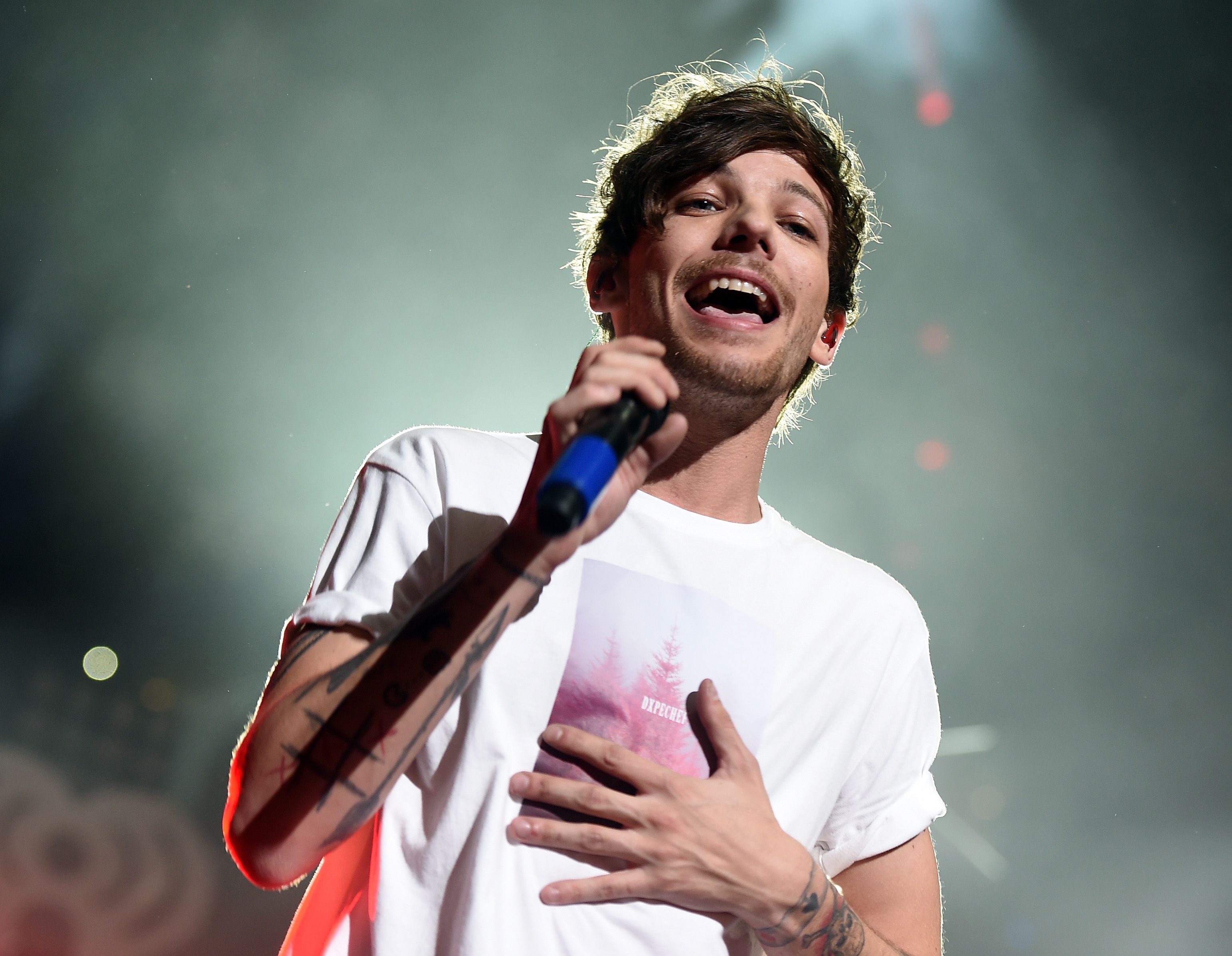 One Direction's Louis Tomlinson celebrates band's anniversary