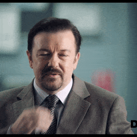 David Brent covering his mouth