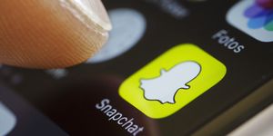 BERLIN, GERMANY - SEPTEMBER 27: In this photo illustration the app of Snapchat is displayed on a smartphone on September 27, 2016 in Berlin, Germany. (Photo Illustration by Thomas Trutschel/Photothek via Getty Images)