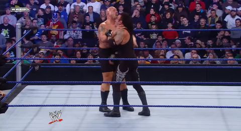 Big Show chokeslams The Undertaker in a casket match