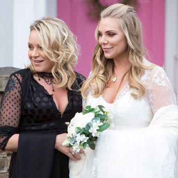 Ronnie and Roxy Mitchell travel to the wedding in EastEnders