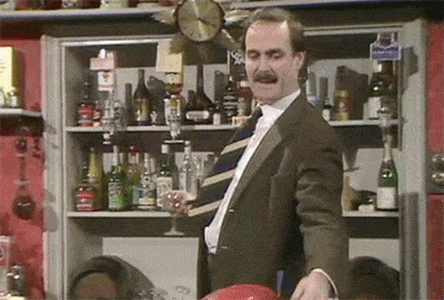 1483542588-fawlty-towers-basil-fawlty-john-cleese-bar-trick-funny.gif