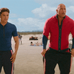 Baywatch: Zac Efron and The Rock strip down to their Speedos [GIF]