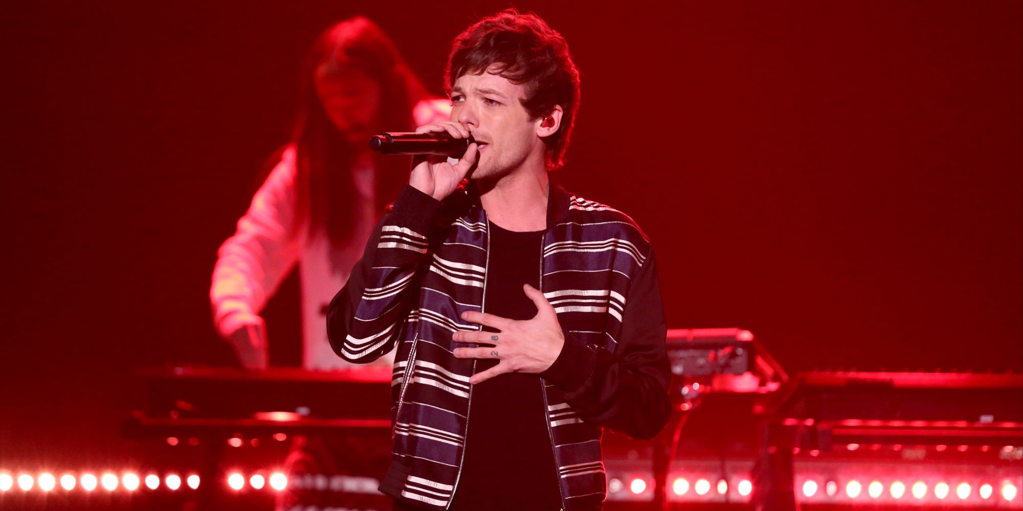 Louis Tomlinson of One Direction performs live during the X Factor Live  tour, at Wembley Arena, London. EDITORS PLEASE NOTE: Editorial use only, no  merchandise, no use after July 10, 2011. Further