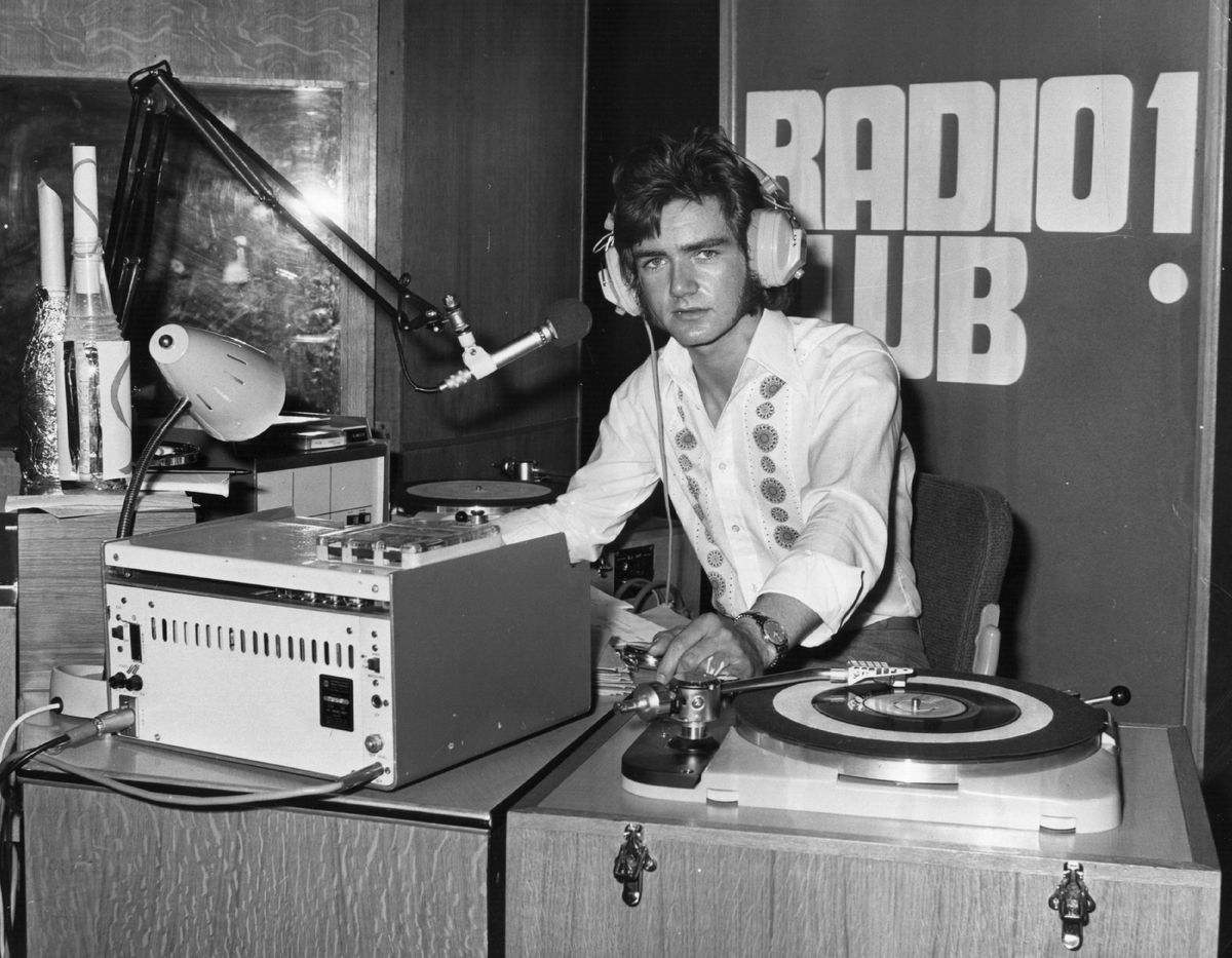 22nd July 1970: BBC disc jockey, 21 year-old Noel Edmunds in the Paris Cinema studio in Lower Regent Street. Noel is to take over Kenny Everett's spot on Radio 1, Everett was dismissed by the BBC following his broadcast jibe about the advanced driving test of Mrs Peyton, wife of the Minister of Transport. (Photo by Wesley/Keystone/Getty Images)