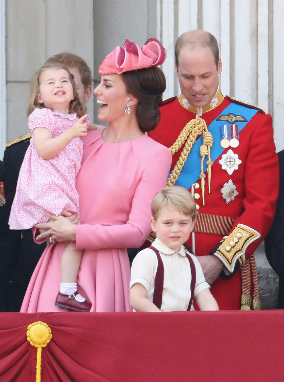 Catherine, Duchess of Cambridge, Princess Charlotte of Cambridge, Prince George of Cambridge and Prince William, Duke of Cambridge look out from the balcony of Buckingham Palace during the Trooping the Colour parade on June 17, 2017
