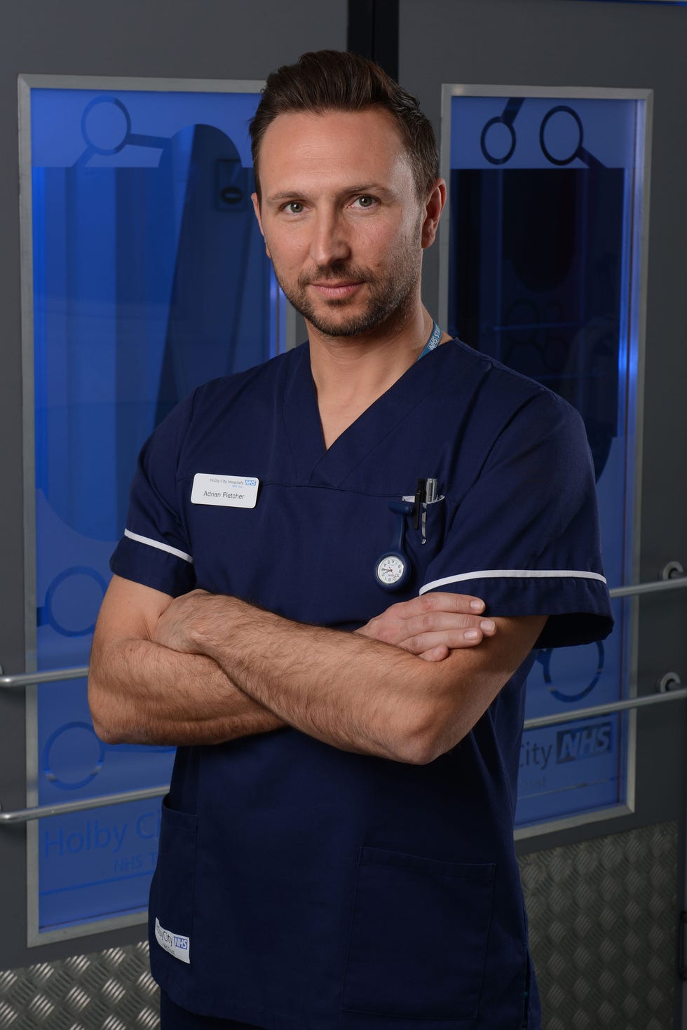 alex walkinshaw as adrian 'fletch' fletcher in holby city