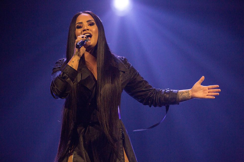 demi lovato performs on stage during her 'tell me you love me' world tour opener
