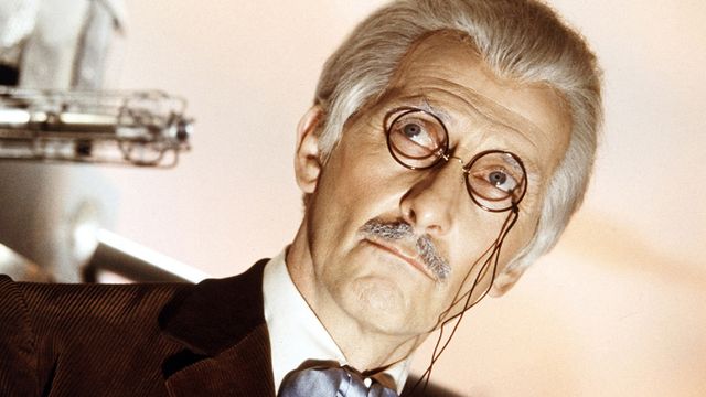 peter cushing as dr who wearing spectacles