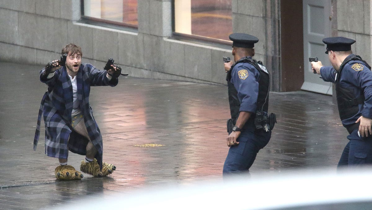 Daniel Radcliffe fight cops in his pants wearing monster slippers in