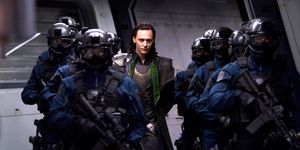 Loki (Tom Hiddleston) escorted by SHIELD agents