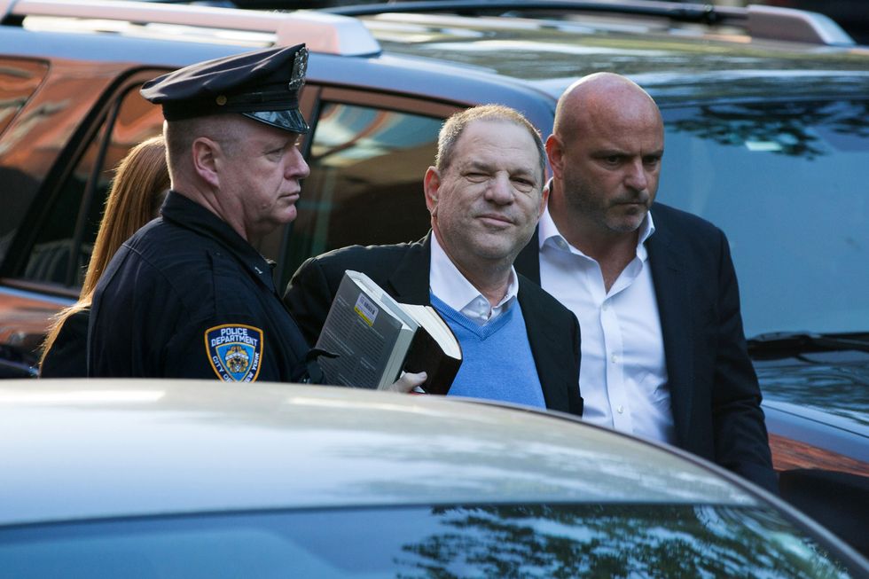 Harvey Weinstein hands himself in at a New York Police station