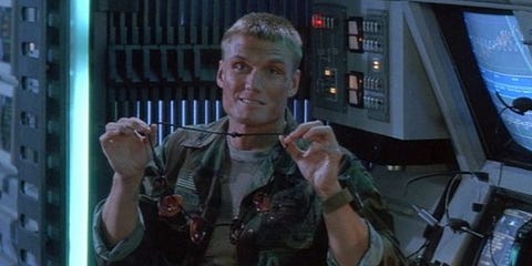 1530186467-dolph-lundgrens-ear-necklace-in-universal-soldier-1992.jpg