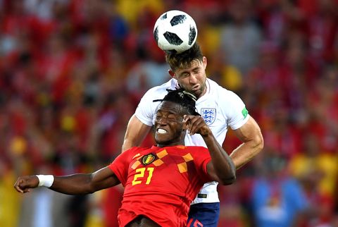 Gary Cahill of England competes for a header with Michy Batshuayi of Belgium during the 2018 FIFA World Cu