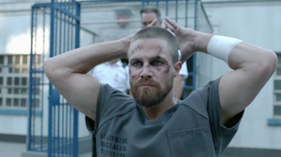 Arrow S Oliver Queen Has To Make Some Questionable Choices To Survive In Prison Says Showrunner