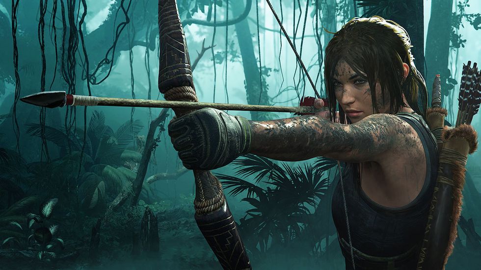 shadow of the tomb raider screenshot, lara croft, covered in mud, readies her bow in a blue tinted jungle setting