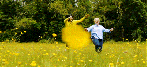 Sandi Toksvig and Noel Fielding frolicking in a field on The Great British Bake Off