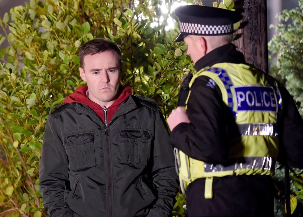 Tyrone Dobbs is confronted by a police officer in Coronation Street