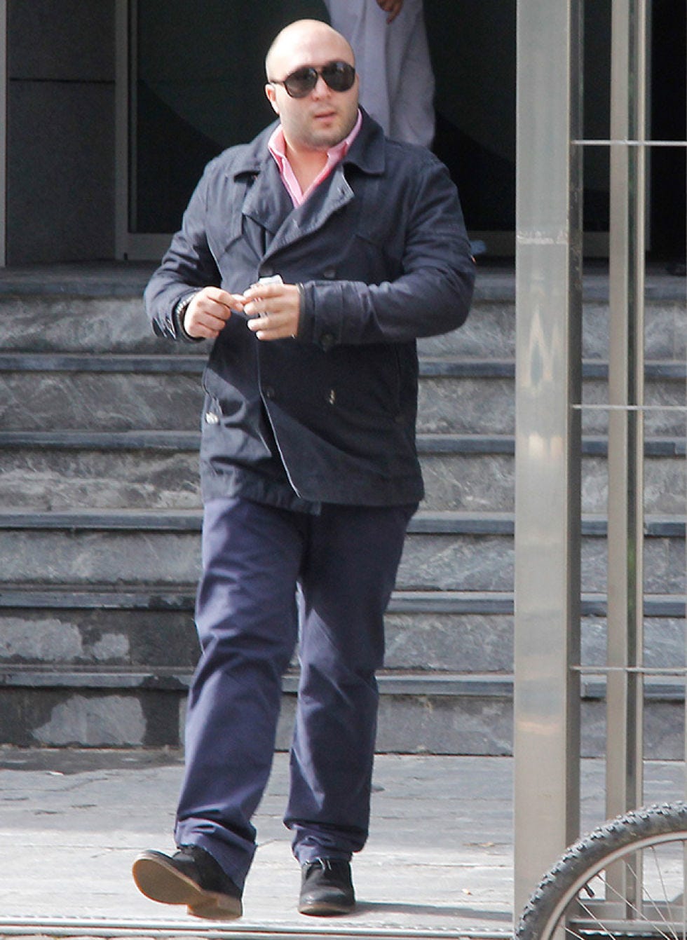 Clothing, Trousers, Shirt, Standing, Outerwear, Stairs, Collar, Sunglasses, Hat, Style, 