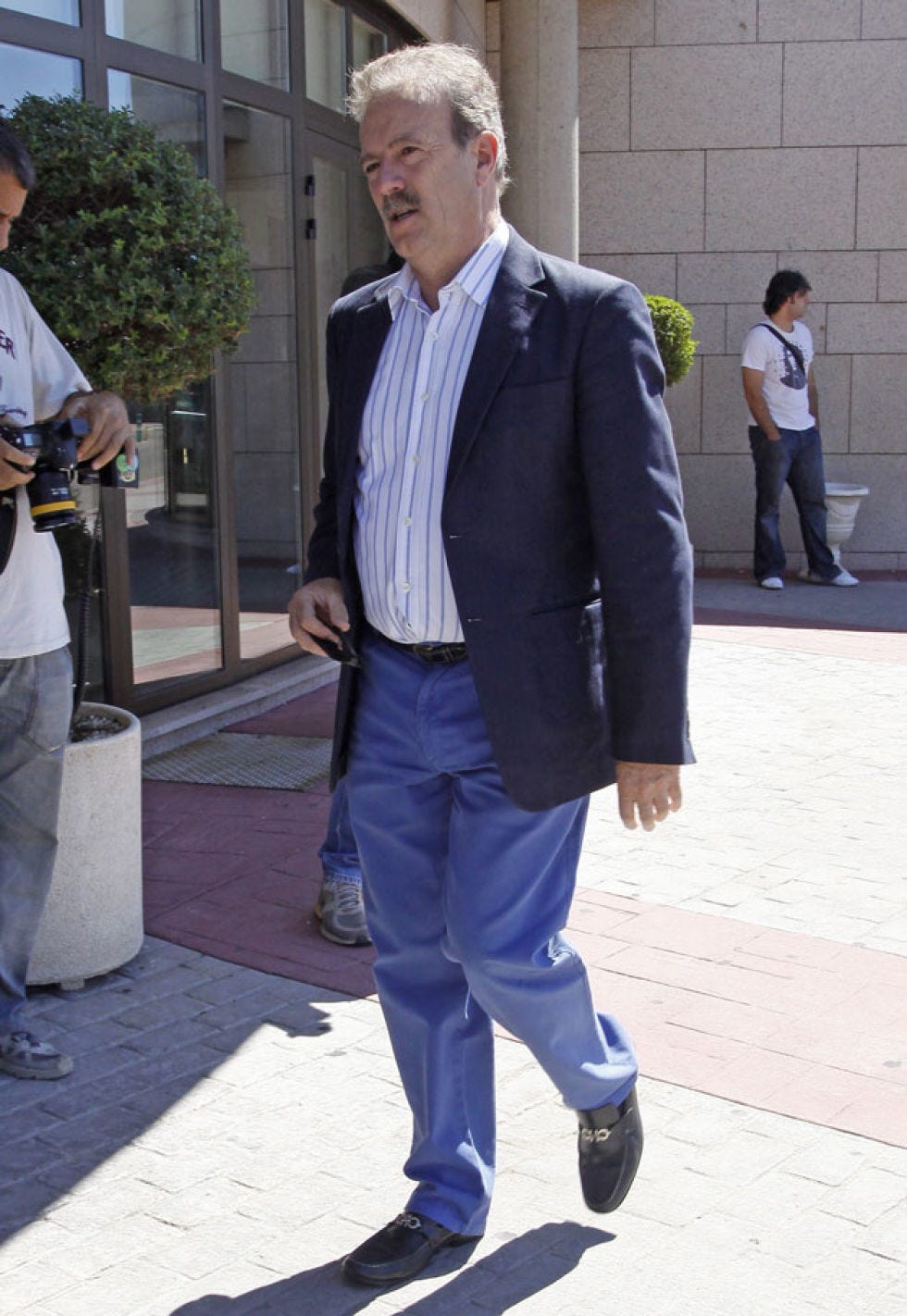 Clothing, Footwear, Leg, Arm, Trousers, Collar, Dress shirt, Shirt, Standing, Photograph, 