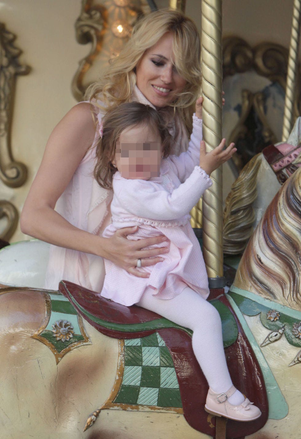 Human, Nose, Sitting, Blond, Lap, Amusement park, Carousel, Long hair, Amusement ride, Horse, 